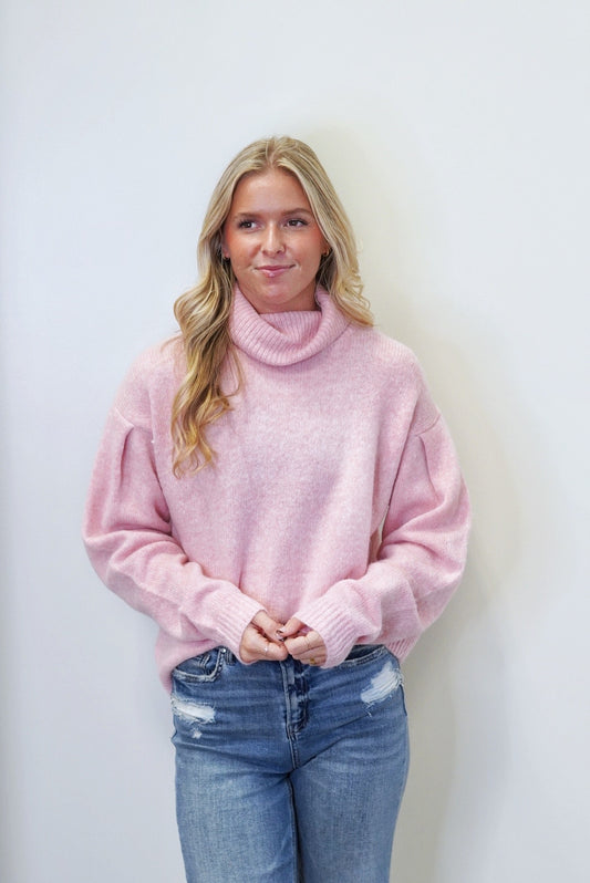 Pretty in Pink Turtleneck Sweater Turtleneck Cuffed Long Sleeves Cozy Knit Material Rubbed Hem Color: Pink Relaxed Fit Full Length 50% Nylon, 25% Acrylic, 25% Polyester