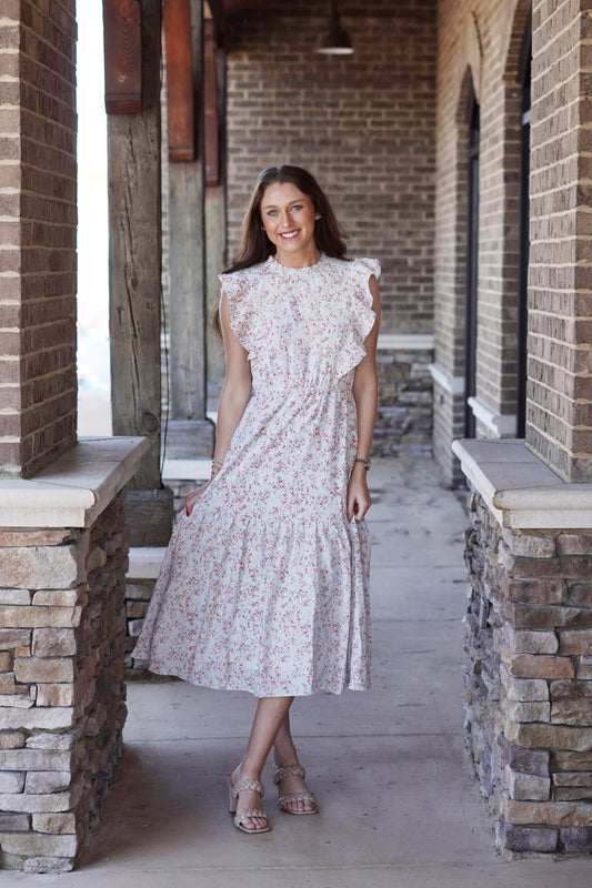 Brae Blue Floral Tiered Ruffle Midi Dress Smocked Mocked Neckline Sleeveless w/ Ruffled Detail on Hem Tiered Ruffle Design Color: Sky Blue w/ Coral Floral Print Relaxed Fit Midi Length 100% Polyester