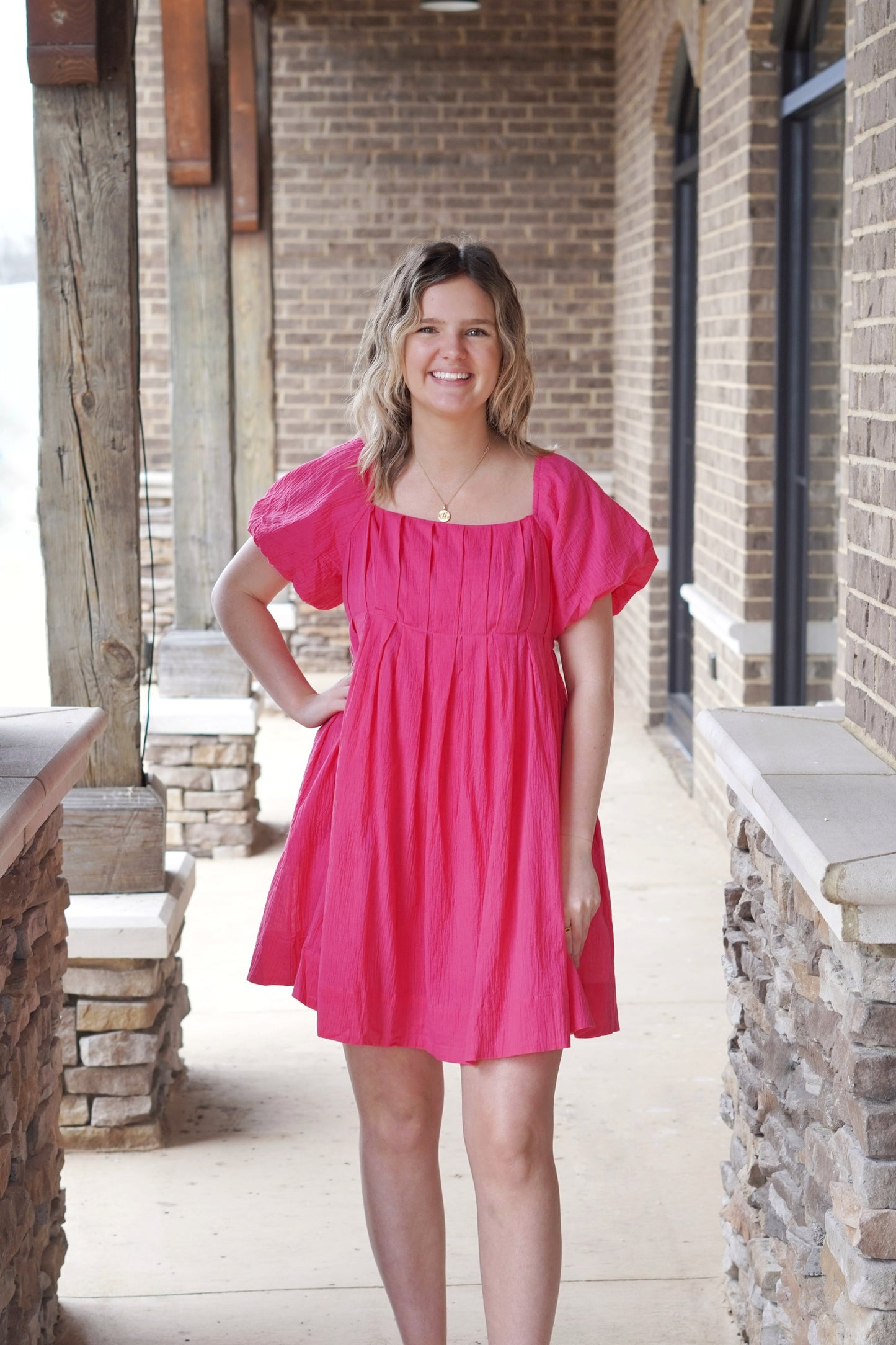 <ul> <li>Paris Puff Sleeve Mineral Gauze Dress</li> <li>Straight Neckline</li> <li>Short Puff Sleeves</li> <li>Pleated Bodice</li> <li>Pockets</li> <li>Color: Fuchsia </li> <li>Self Back Tie</li> <li>Smocked Back</li> <li>Relaxed Fit</li> <li>Knee Length</li> <li>100% Cotton</li> </ul>