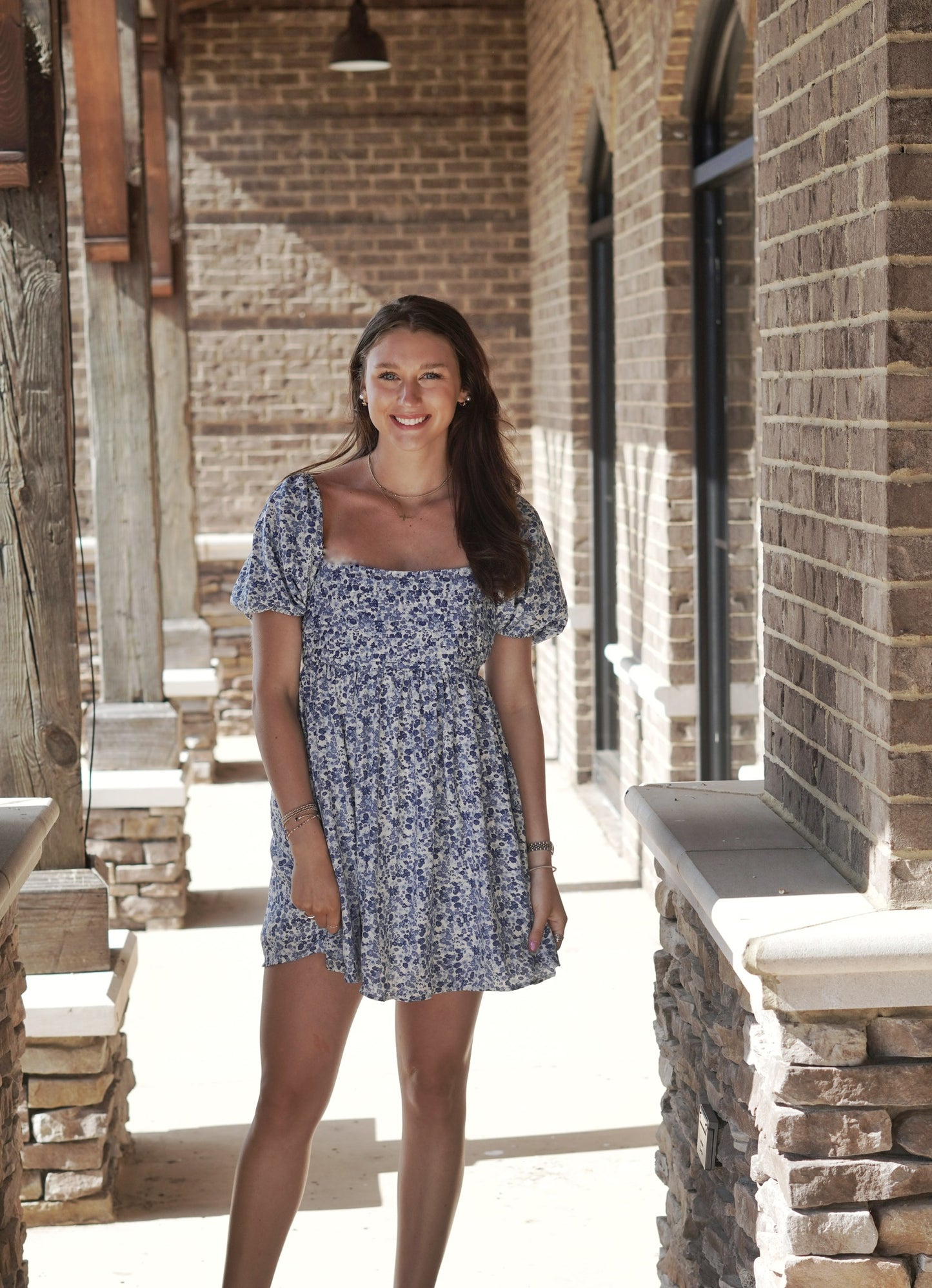 Providence Puff Sleeve Mini Dress Short Puff Sleeves Square Neckline Pleated Bodice Color: Blue Mix and White Floral Pattern Mid Thigh Length Babydoll Fit 100% Polyester