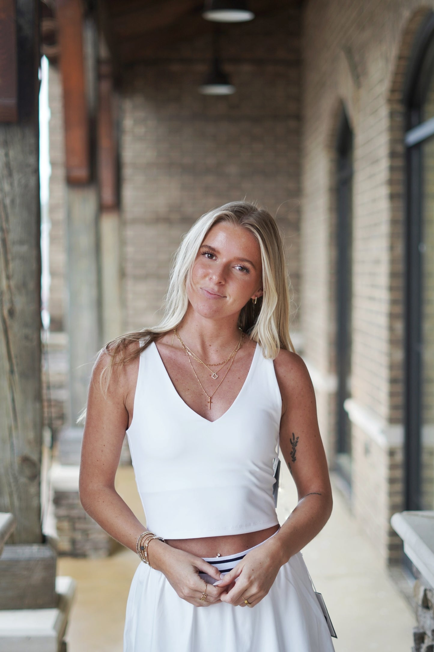 <ul> <li>Z Supply V-Neck Longline Tank Bra</li> <li>V-Neckline Front And Back</li> <li>Sleeveless</li> <li>Relaxed</li> <li>Built In Bra Pads</li> <li>Removable Bra Pads</li> <li>Cropped Fit</li> <li>True To Size</li> <li>Color: White</li> <li>Length From Shoulder 16 1/4"</li> <li>Fabric Content: Pure Performance: 80% Polyester, 20% Spandex</li> <li></li> </ul>