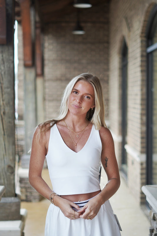 <ul> <li>Z Supply V-Neck Longline Tank Bra</li> <li>V-Neckline Front And Back</li> <li>Sleeveless</li> <li>Relaxed</li> <li>Built In Bra Pads</li> <li>Removable Bra Pads</li> <li>Cropped Fit</li> <li>True To Size</li> <li>Color: White</li> <li>Length From Shoulder 16 1/4"</li> <li>Fabric Content: Pure Performance: 80% Polyester, 20% Spandex</li> <li></li> </ul>