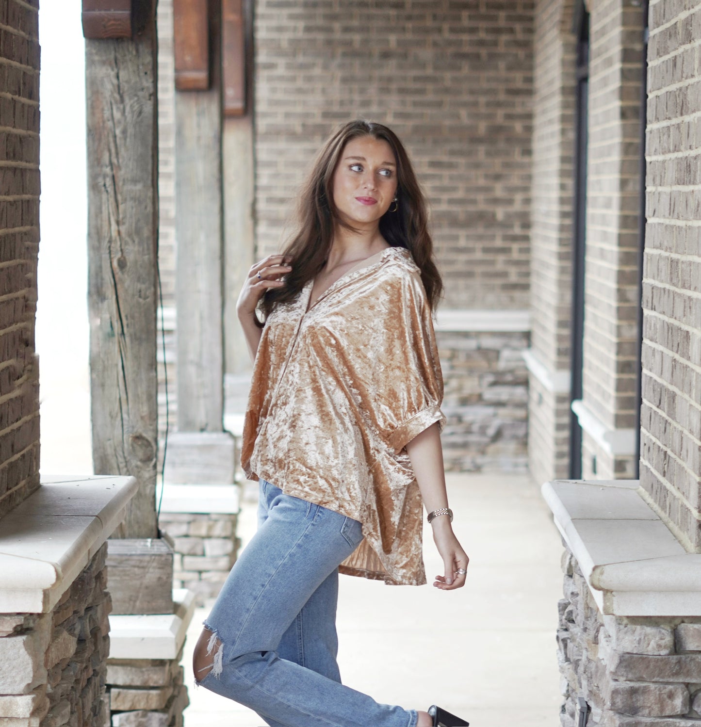 Camilla Crushed Velvet Collared Blouse Collared Neckline Short Bat Wing Sleeves Color: Camel Crushed Velvet Fabric Button Down Detail Longer Length in the Back Relaxed Fit Full Length 95% Polyester, 5% Spandex