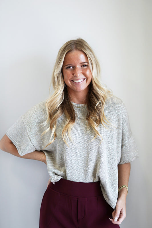 Show Off Your Shine Knit Top Round Neckline Short Sleeves Grey/Silver Color Knit Skimmer Length Relaxed Fit 42% Cotton, 35% Acrylic, 15% Polyester, 8% Metal Care: Hand wash cold with like colors, Do not bleach, Flat dry, Do not iron