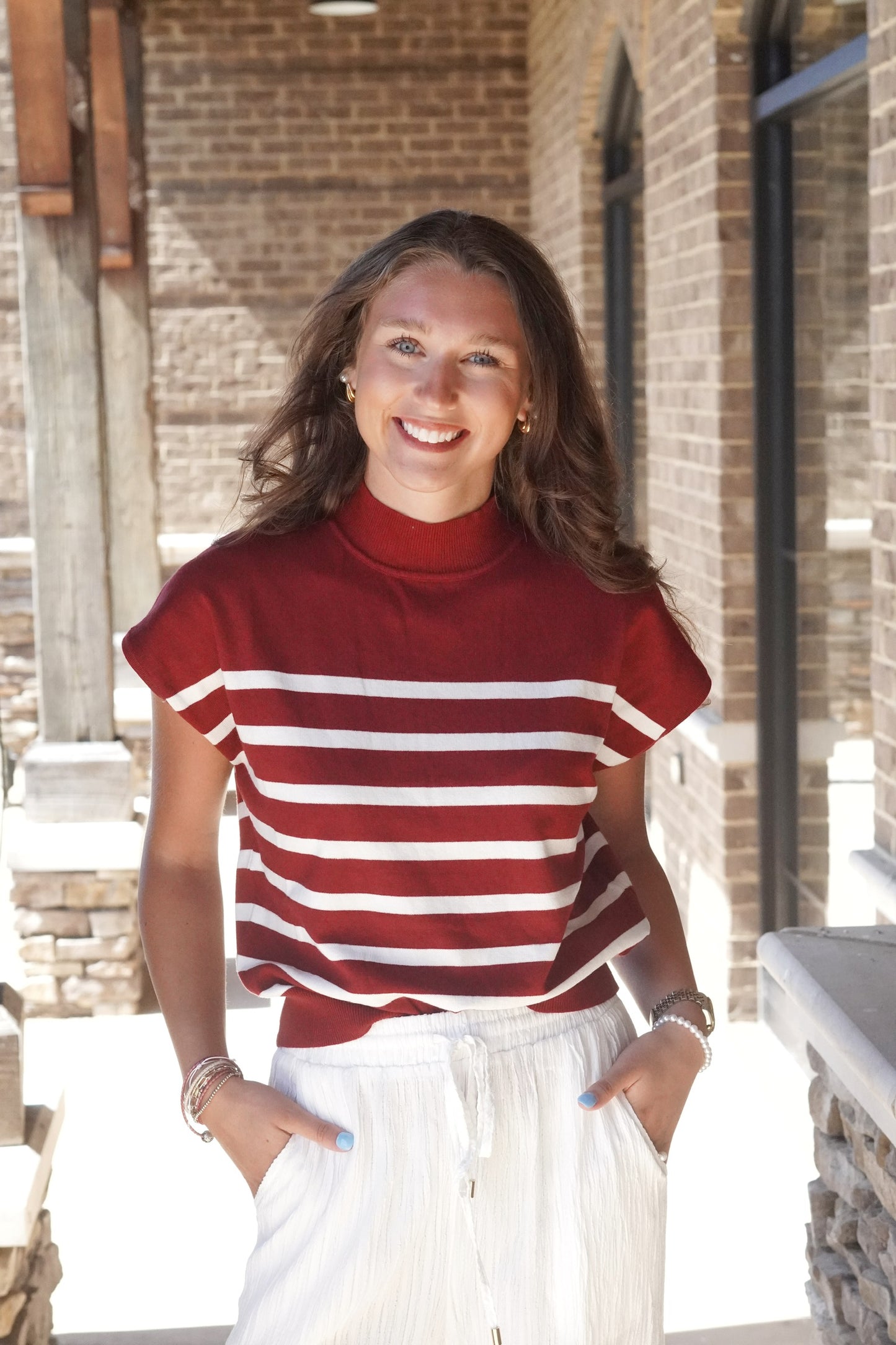 Charlotte Striped Mock Neck Top Mock Neckline Short Sleeves Striped Knit Material Relaxed Fit Full Length 44% Viscose, 28% Nylon, 28% Polyester merlot with white stripes