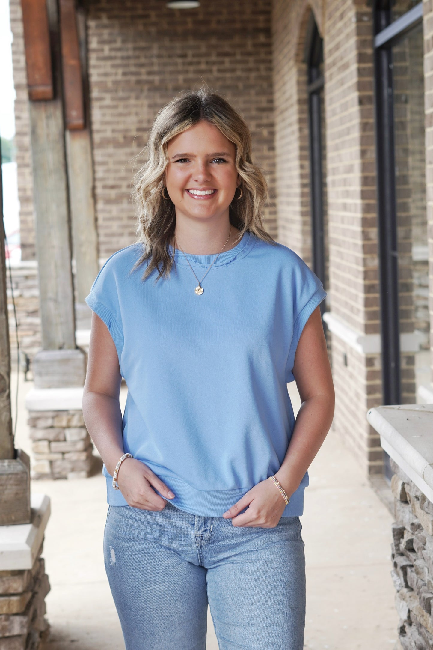 Call It a Day Crew Neck Top Crew Neckline Cap Sleeves Cuffed and Ribbed Hem Color: Sky Blue Relaxed Fit Full Length 100% Cotton