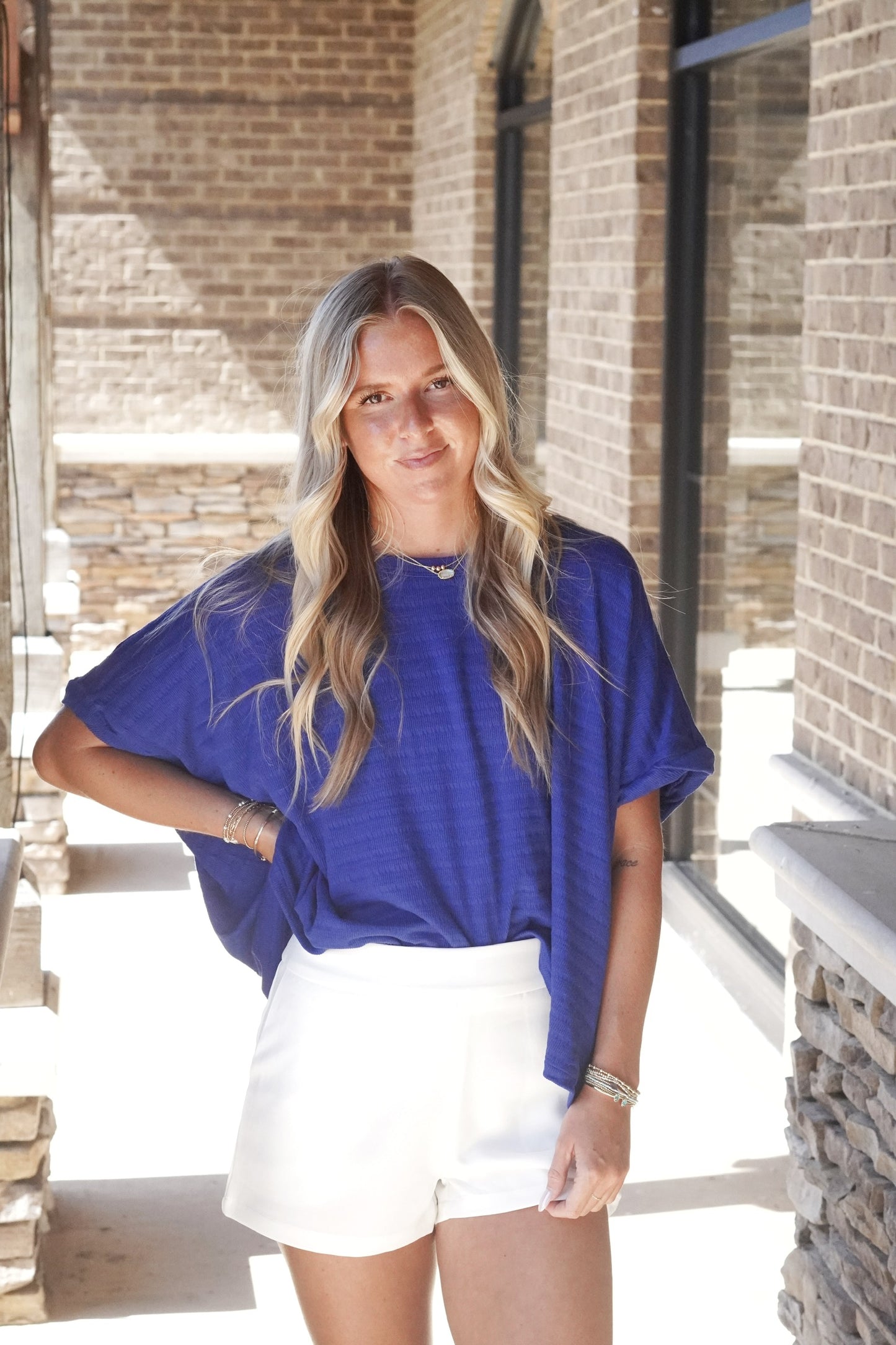 Tara Textured Relaxed Top Crew Neckline Short Sleeves Textured Material Relaxed Fitt Full Length 60% Polyester, 35% Cotton, 5% Polyester royal blue color