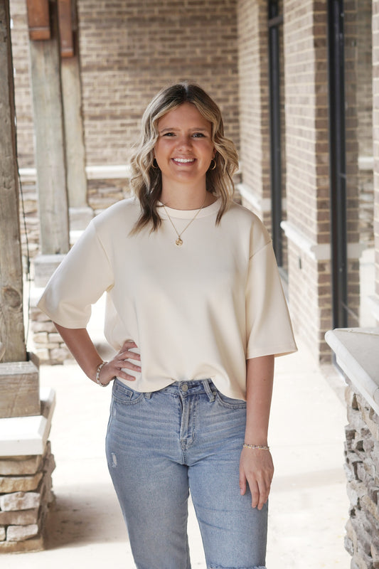 Lina Layered Split Back Modal Top Crew Neckline Short Sleeves Layered Split Back Feature Color: Eggshell Skimmer Length' Relaxed Fit 48% Modal, 48% Polyester, 4% Spandex