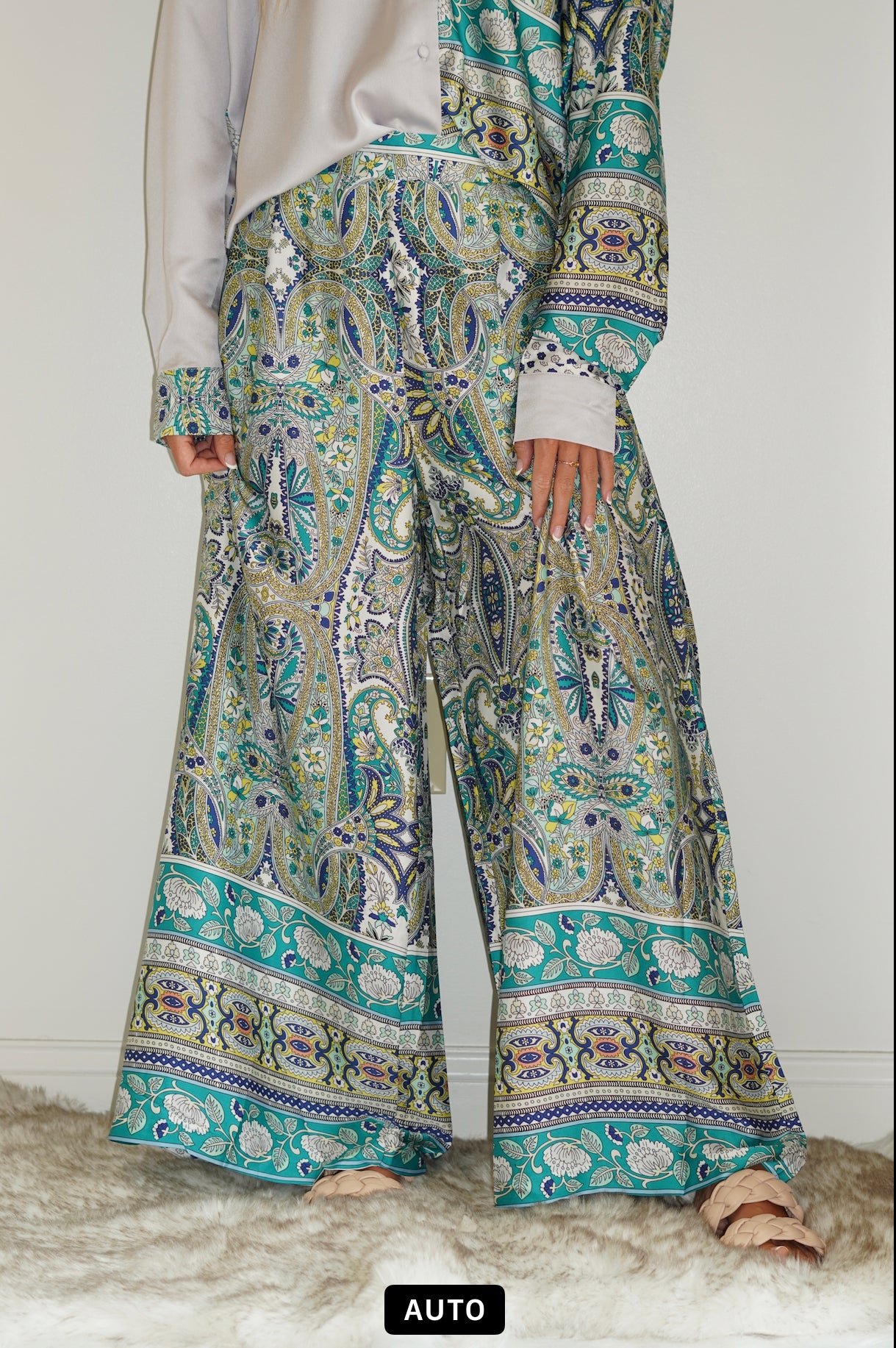 Paisley Satin Print Wide Leg Pants Elastic band on back of waistline Wide Leg Satin Material Teal Printed Pants Fitted waistband, Pants length comes to below the ankles. 100% Polyester Hand wash cold, do not bleach. Hang or line dry. Model is wearing size Small