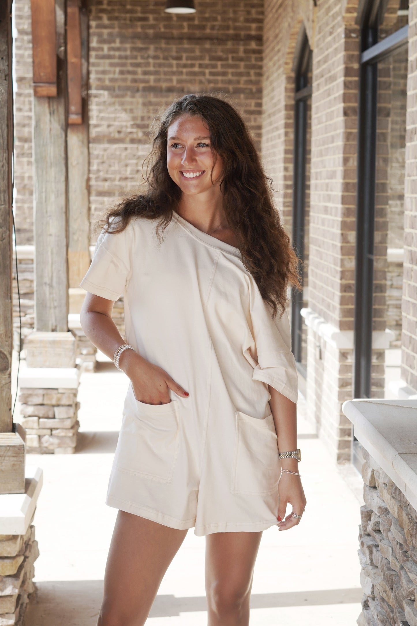 Taylor Tee Shirt Romper Round Neckline Short Sleeves Raw Hem Mid-Thigh Length Shorts Relaxed Fit Color: Bone 95% Cotton, 5% Spandex