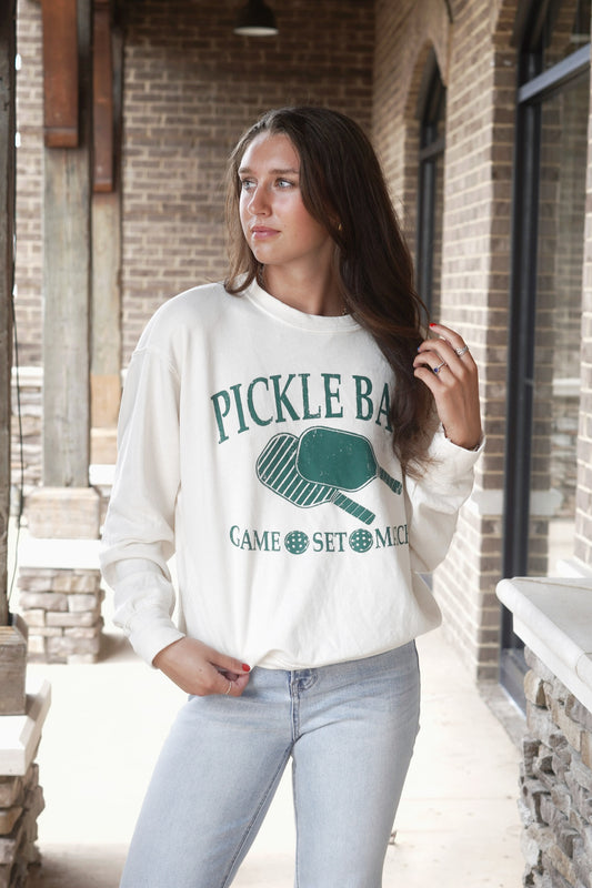Pickle Ball Crew Neck Sweatshirt Crew Neckline Long Cuffed Sleeves Color: Ecru Green Pickle Ball Graphic Relaxed Fit Full Length 50% Cotton, 50% Polyester