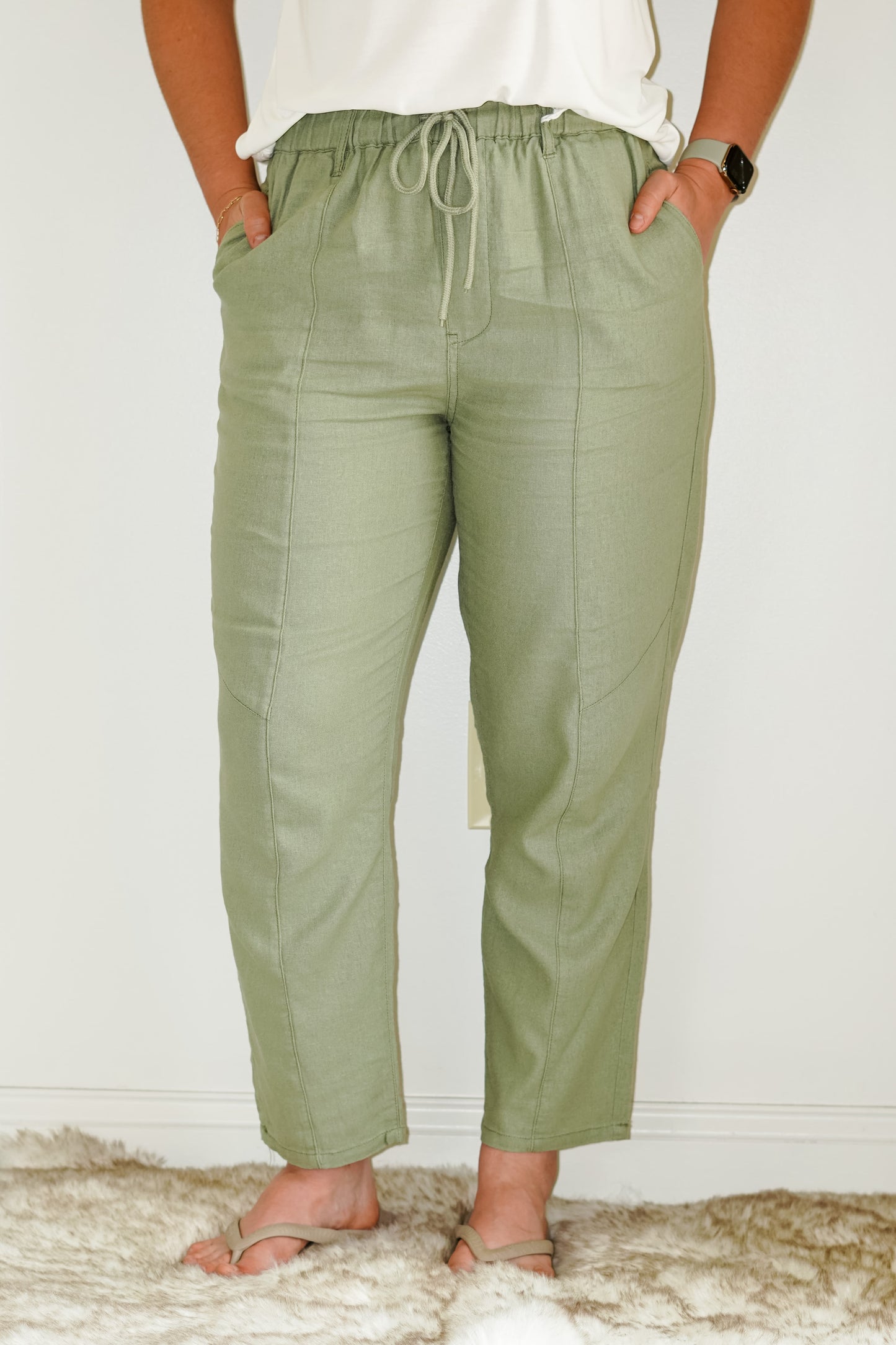 Emerson Pull On Linen Pants Color- Sage Ribbed Waist Line Tie Two Front Pockets 55% Linen 45% Viscose Turn inside out, Machine wash cold, tumble dry low, gentle cycle with colors, Do not bleach, hang to dry, Indigo will bleed, iron if needeD Model is wearing size large