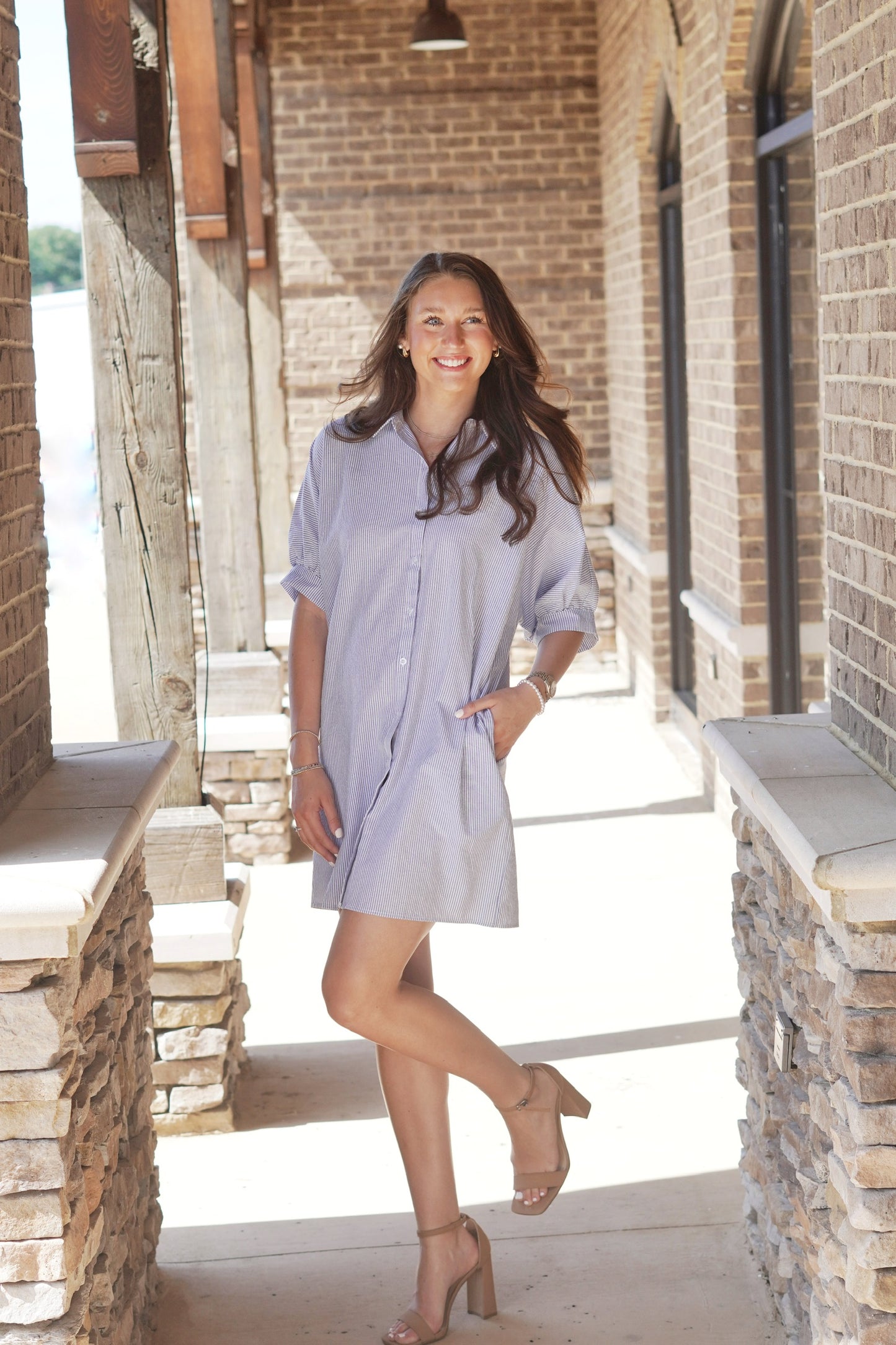 So Breezy Striped Puff Sleeve Dress Collared Neckline Short Cuffed Puff Sleeves Pockets Color: Blue and White Striped Button Up Feature Relaxed Fit Mid-Thigh Length 80% Cotton, 20% Polyester