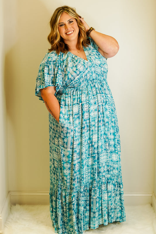 Cassie V-Neck Lush Maxi Dress Elastic v-neck ruffles Sleeve Smocking Detail Ruffle Hemline Maxi Dress 100% Rayon 100% Polyester Hand Wash Cold, Do Not Dry Clean, Do not Iron, Tumble Dry on low if needed