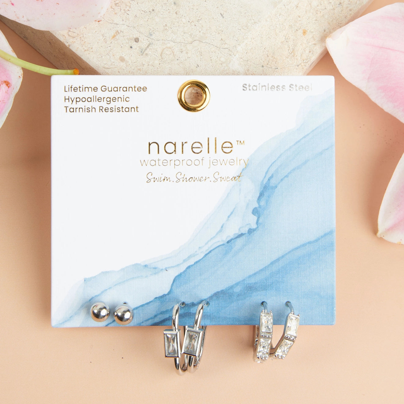 Rectangle Hoop Earring Trio offers three pairs of earrings in trendy hoop, link, and post designs, all in a classic silver.