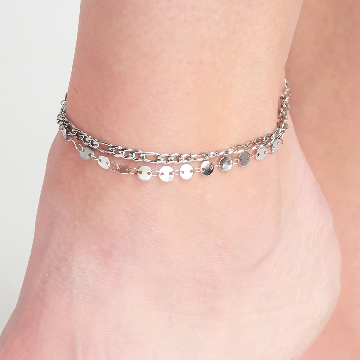 Chain Anklet offers two bands of delicate disc and Figaro chain in a classic silver.