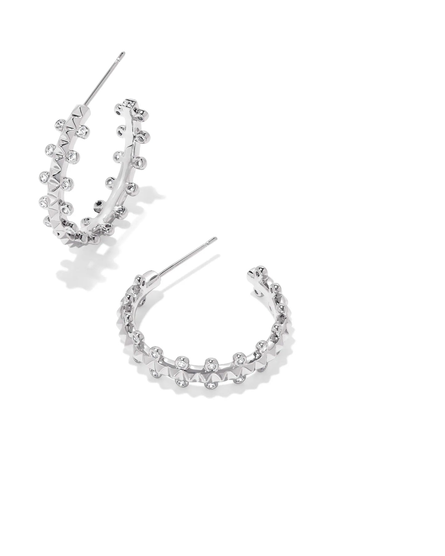 Silver hoop earrings with post backs. White crystalized Detail