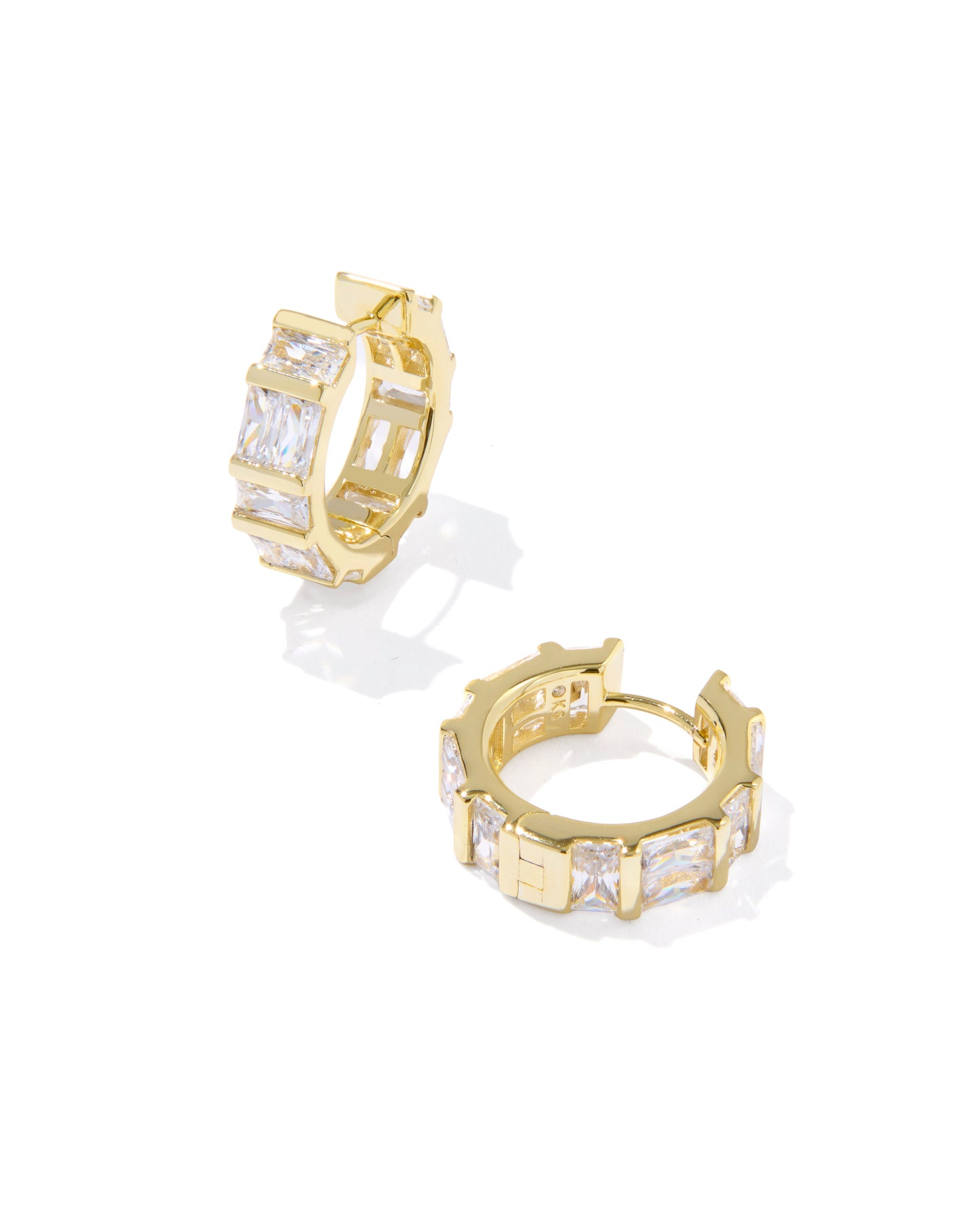 Gold Huggie Earrings with bezel-set baguette crystal detailing and high-shine metal