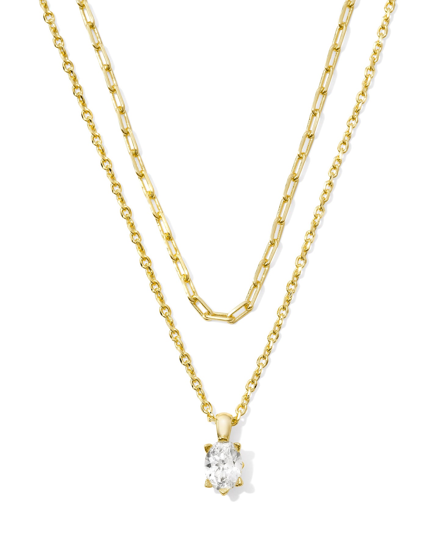 Multi-Strand Gold Necklace With a Single Gemstone Pendant.