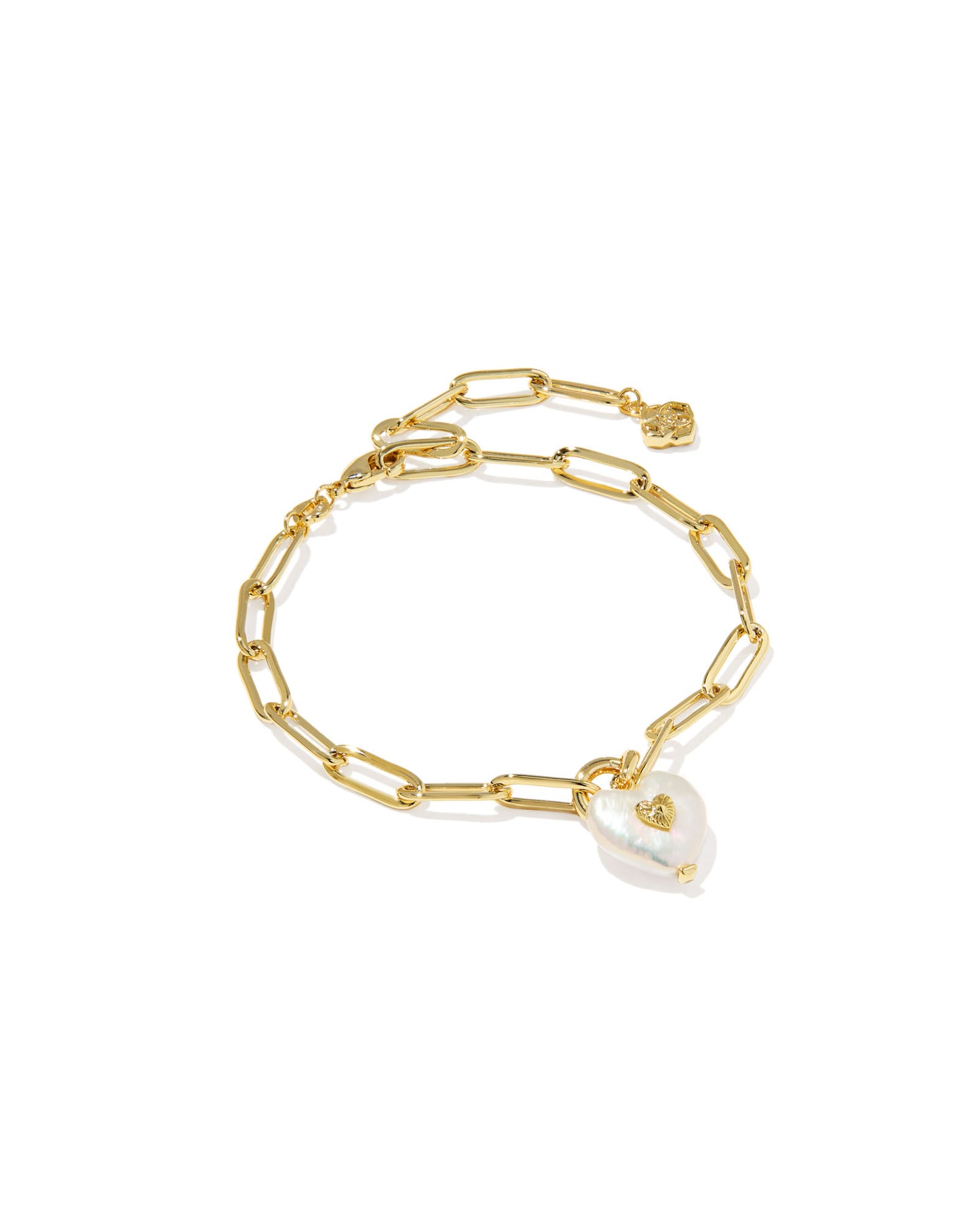 This sweet bracelet features a heart-shaped freshwater cultured pearl charm with a chic metal beauty mark on a paperclip chain, making it an adorable choice for any stack.