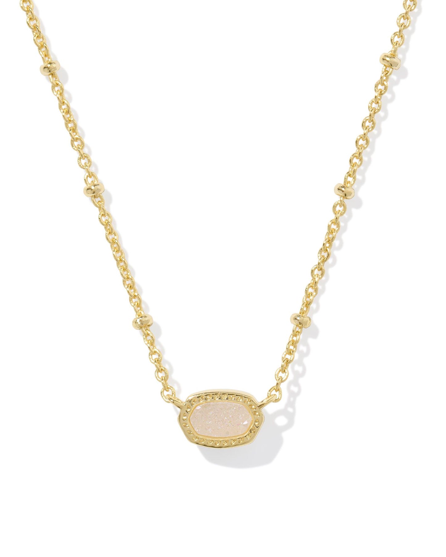 gold necklace with pink stone