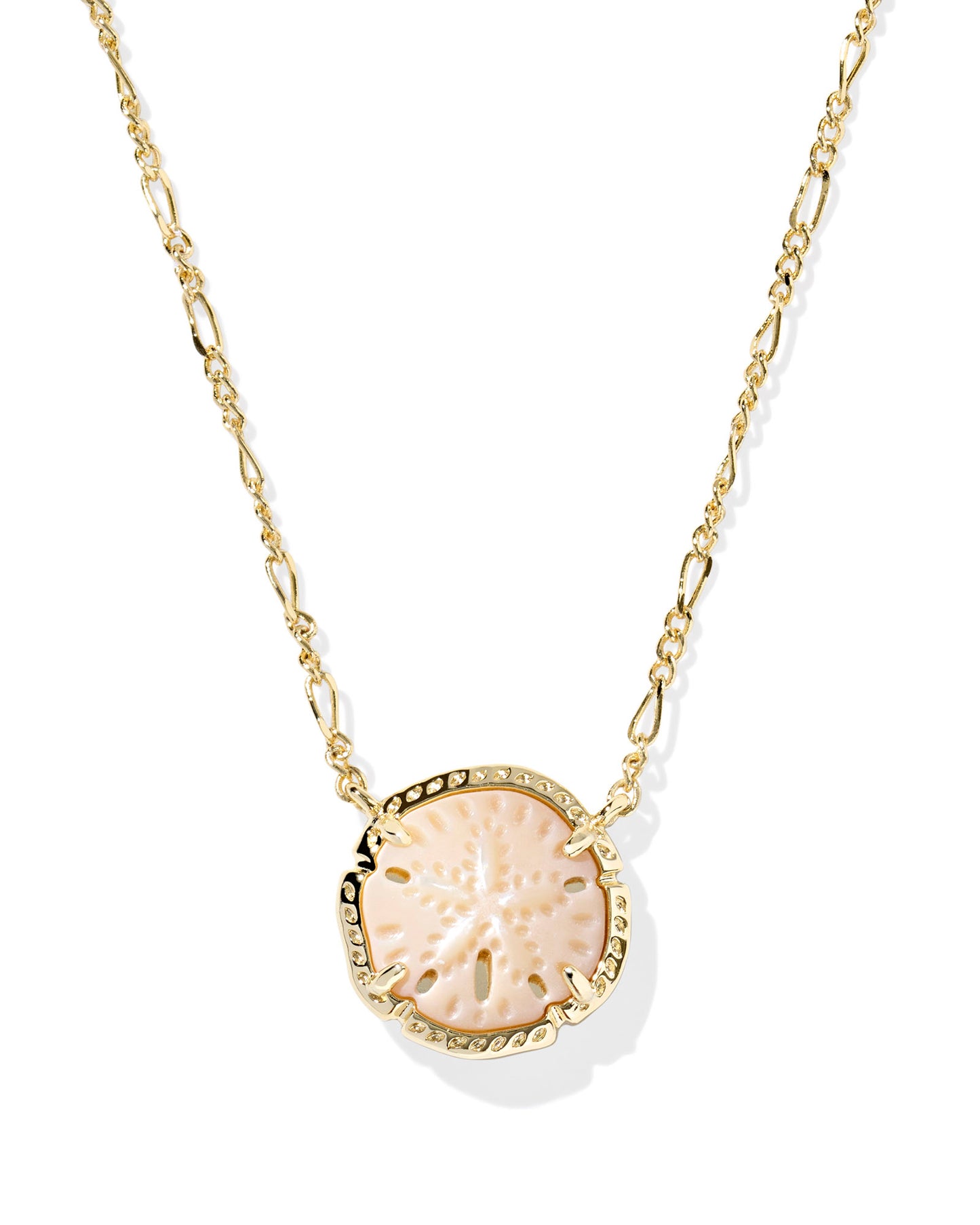 Sand dollar pendant on gold necklace. Sand dollar is light tan with small details that look and feel like a sand dollar.
