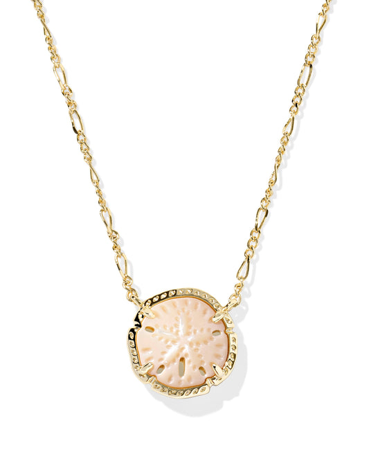 Sand dollar pendant on gold necklace. Sand dollar is light tan with small details that look and feel like a sand dollar.
