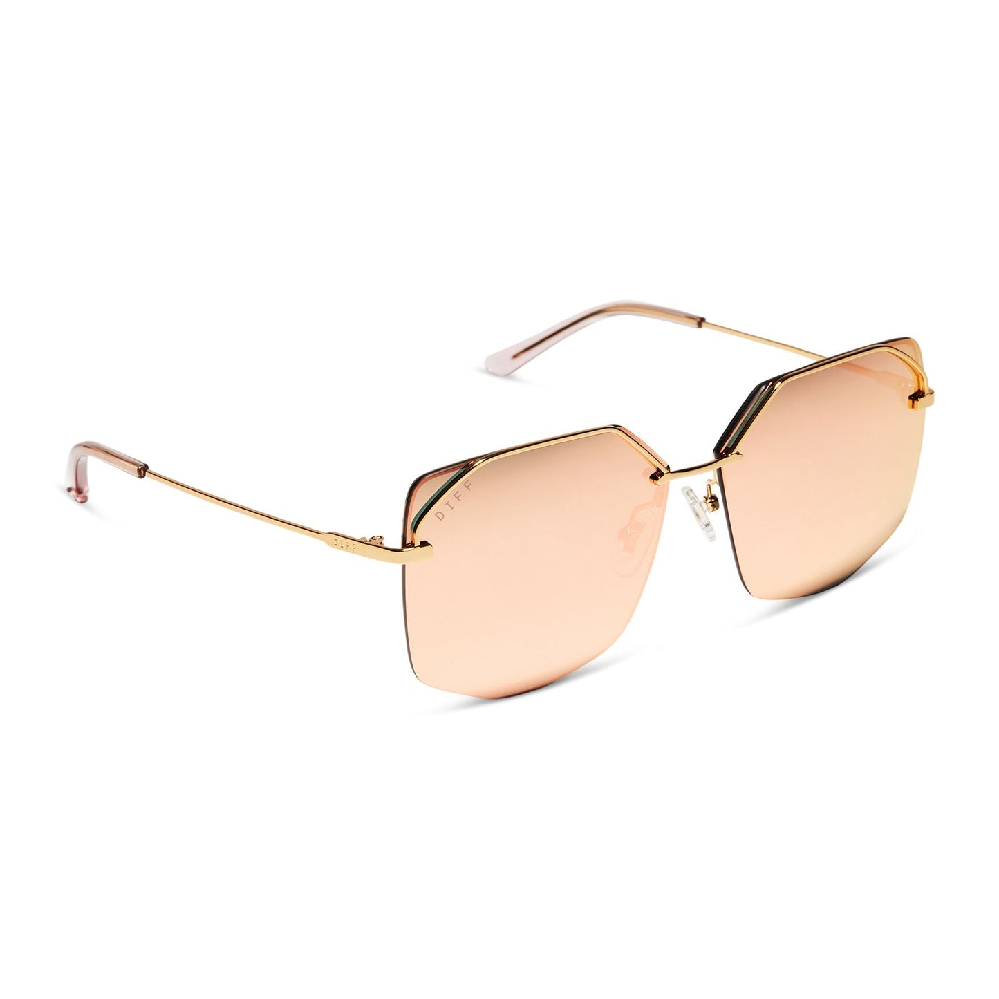 Geometric sunglasses with pink lenses and gold accents with clear nosepieces