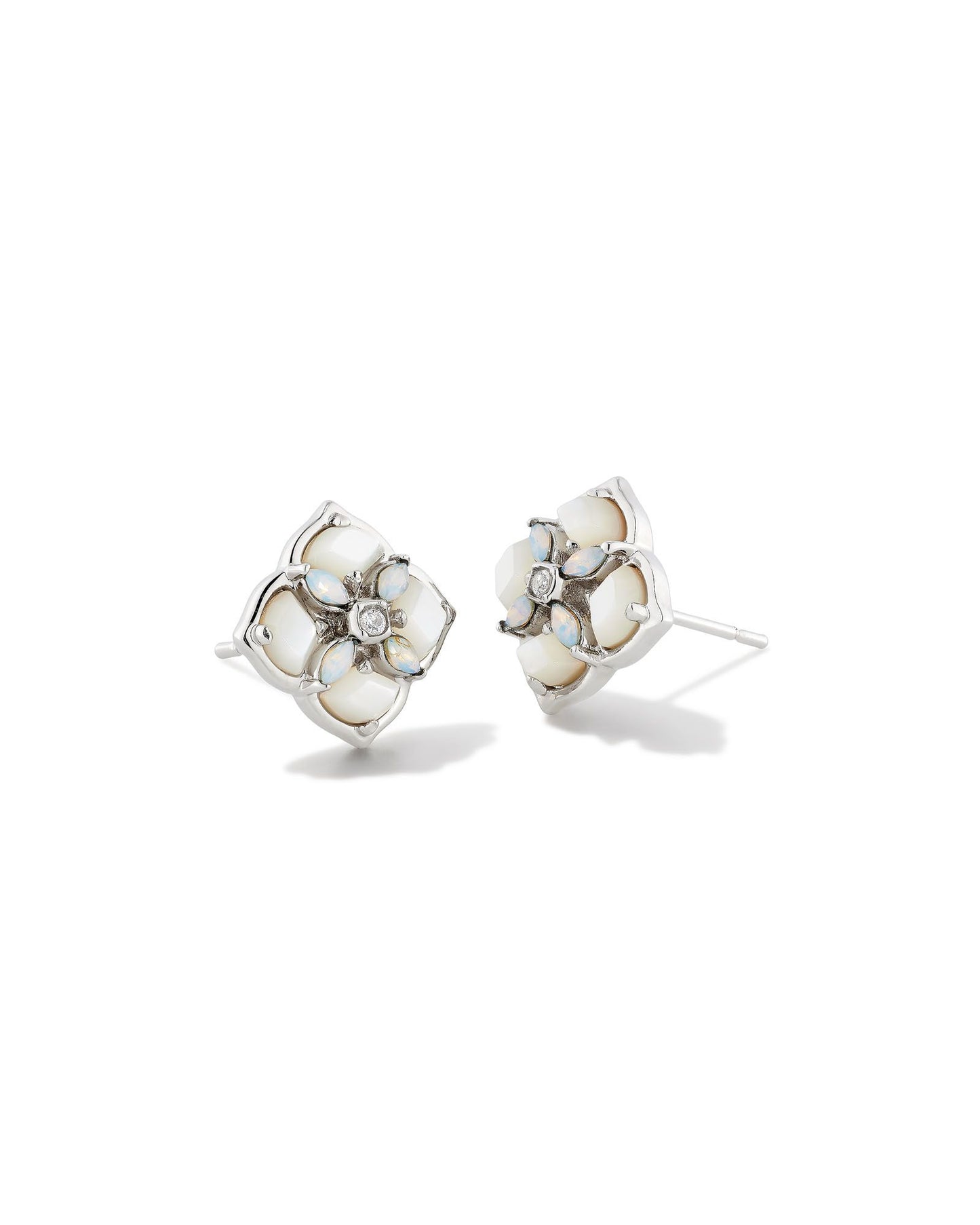 These stud earrings feature subtle stones and gems filled into our logo shape that are sure to lighten up any ensemble. The metal is 24k rhodium plated over brass with white stones.