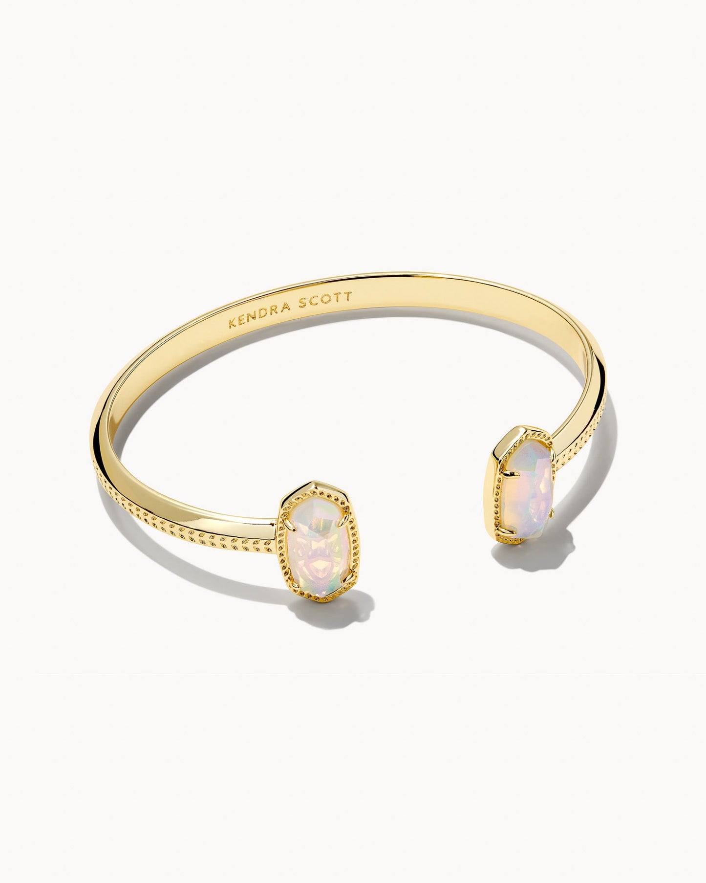 Gold dainty pinch cuff bookended with pearl iridescent oval stones.