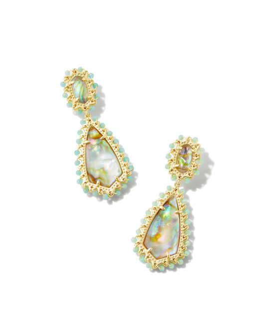 With beads, stones, and iconic brand shapes, the Beaded Camry Statement Earrings in Iridescent Mix really do have it all—grab a pair and get ready to stand out this spring. This metal is 24k gold plated over brass with teal beads and iridescent stone.