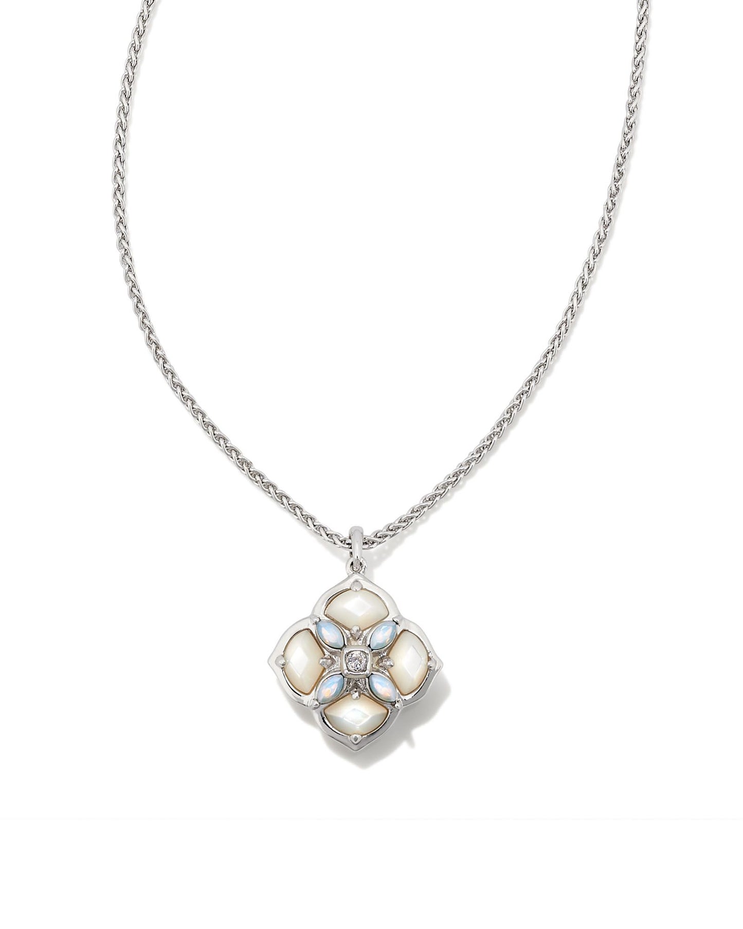 Our signature logo meets gorgeous stone detailing for the first time in the Dira Stone Gold Short Pendant Necklace. Featuring custom-cut stones and gems assembled into our logo shape, this pendant is bound to be a new favorite in your collection. The metal is 24k rhodium plated over brass with white stones.