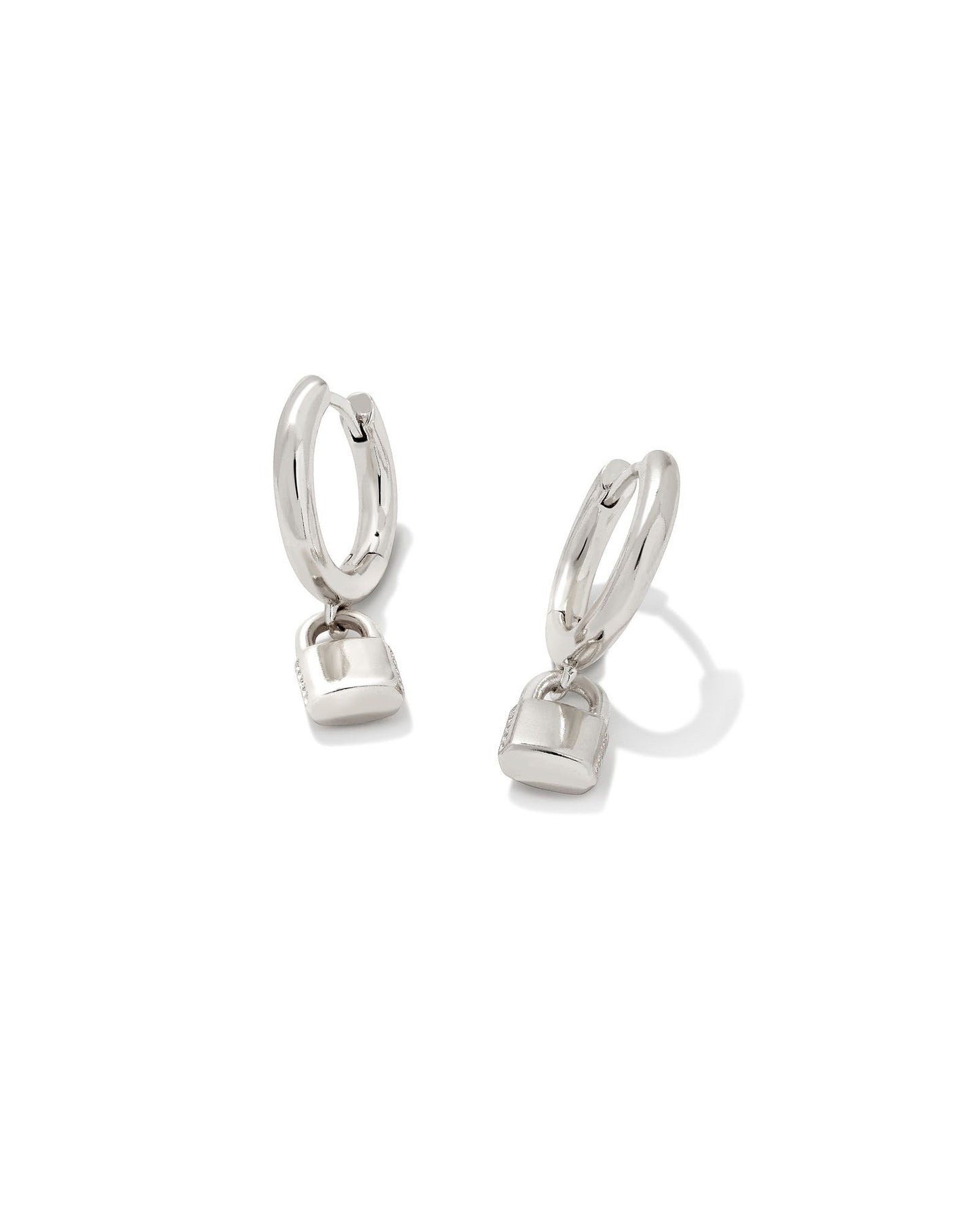 Silver huggie earrings with a lock charm