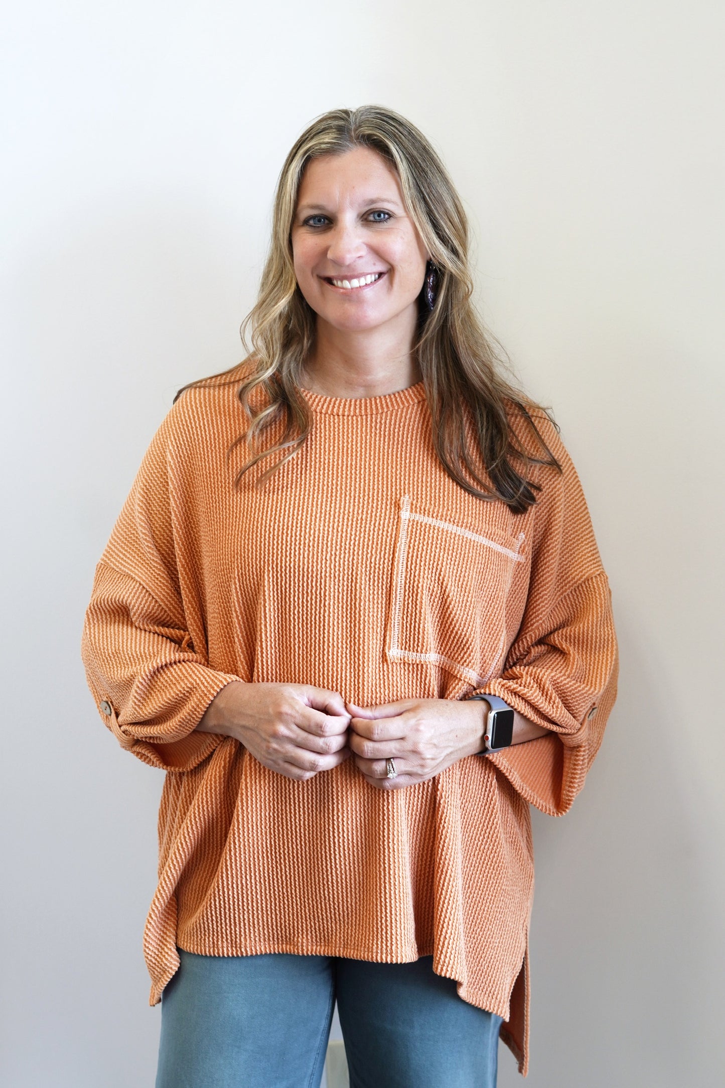 Saylor Spice Two-Tone Top Round neckline Elbow Length Sleeves Button Closure On Sleeves Two-Tone Pocket On Front Color: Orange Full Length, Longer In Back OverSized, Flowy Fit 76% Polyester, 21% Rayon, 3% Spandex.