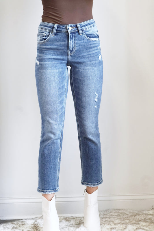 Brandy Cropped Blue Jeans High Waisted Zipper Fly Cropped Length Blue Denim Color Minor Distressing 93% Cotton, 5% Polyester, 2% Spandex