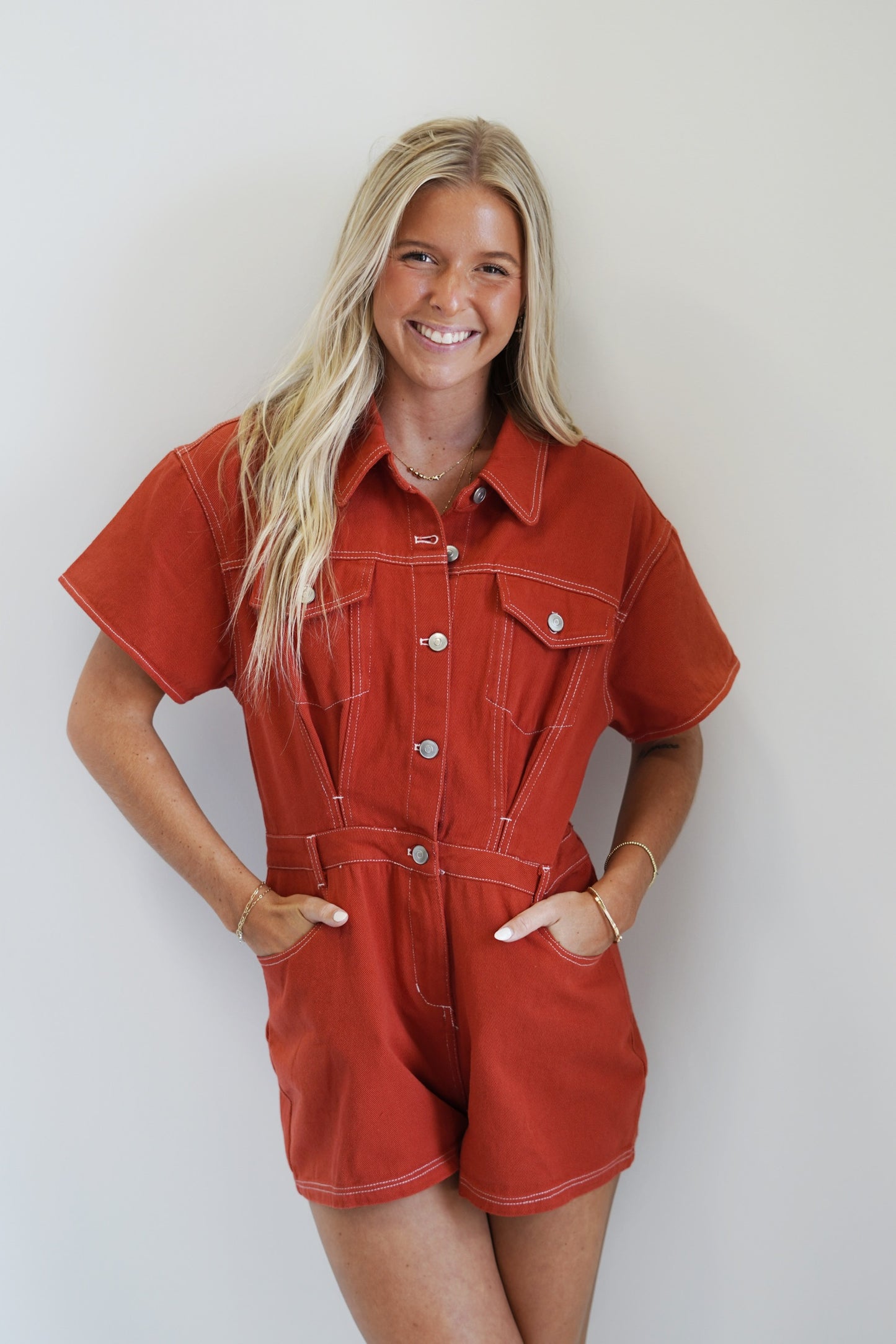 Dolly Denim Utility Romper Collar Neckline Short Sleeves Red Clay Color Romper Fit Denim Material 100% Cotton