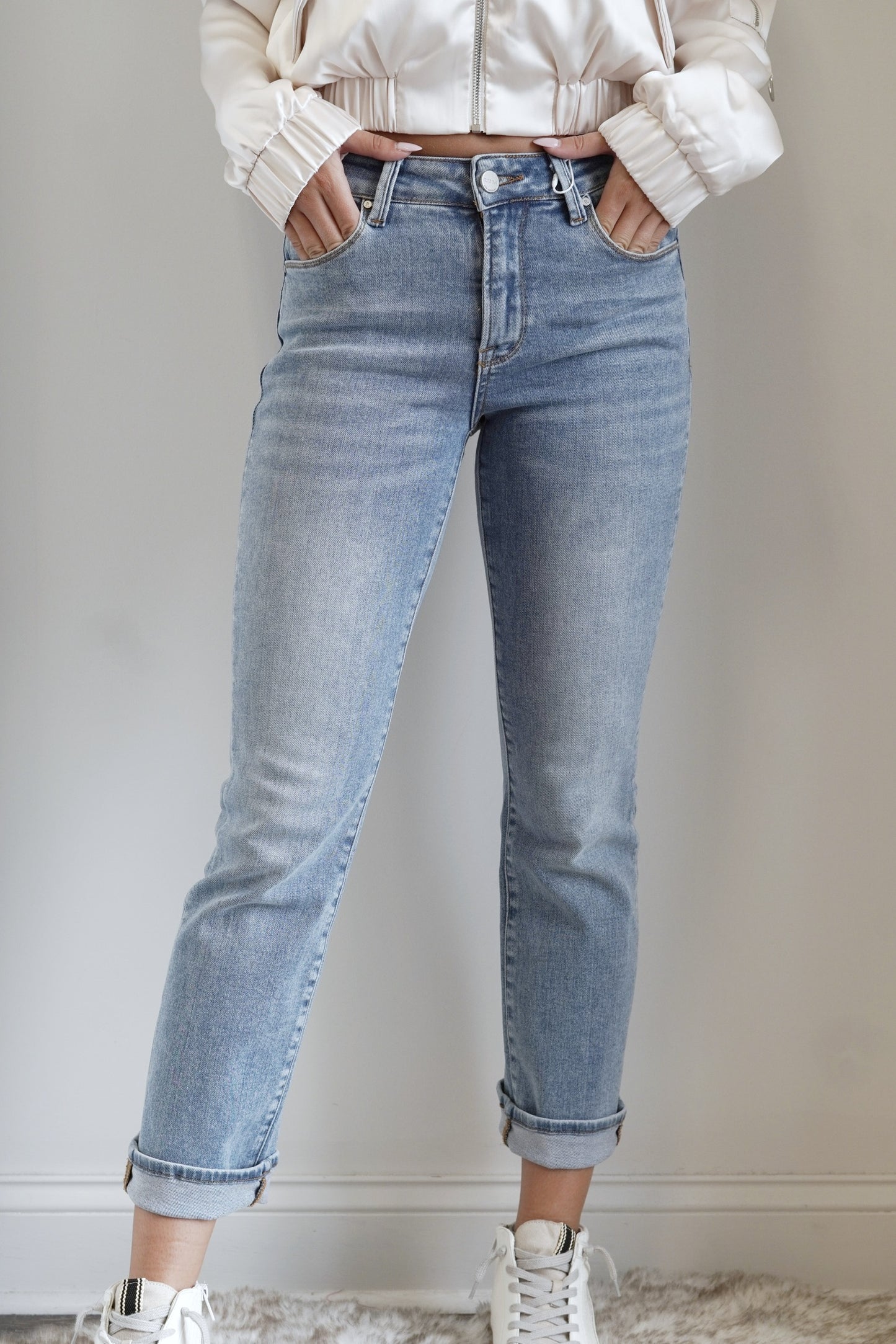 Henley High Rise Slim Straight Jeans Belt Loops on Waistband Button/Zipper Closure Slim Straight Leg Jeans Front and Back Pockets Denim Jeans Fitted Full Length 91% Cotton, 6% Polyester, 3% Spandex