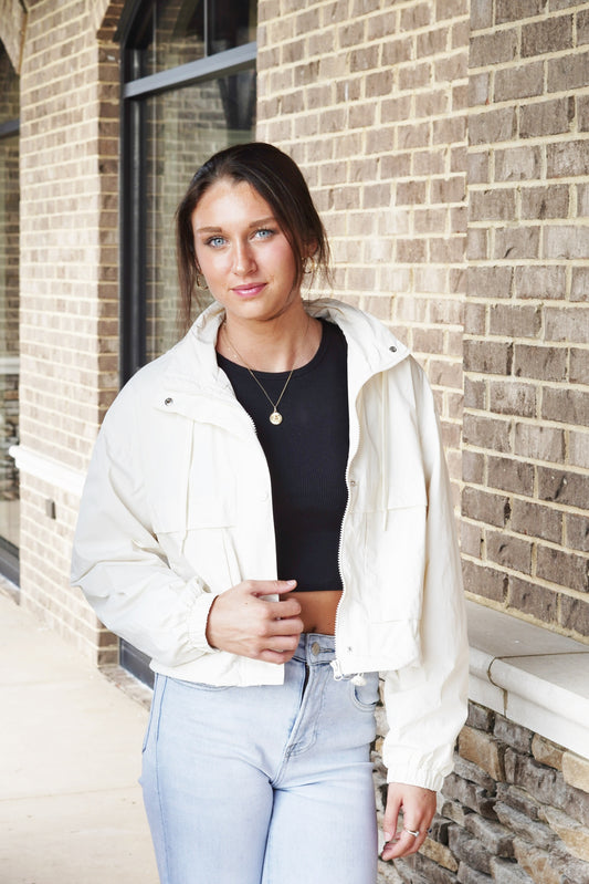 Tiebreak Nylon Jacket Zip Up/ Button Closure Front Pockets Long Cinched Sleeves Hood w/ Drawstrings Bungee Drawstrings to Adjust the Hem Color: Sandstone 100% Nylon