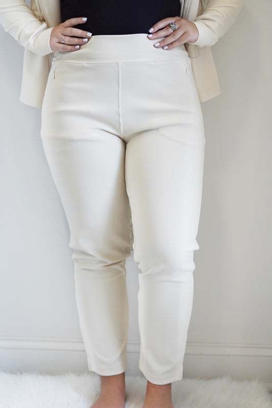 Reyna Ribbed Tapered Pant High Waist Tapered Leg Zipper Pockets Colors: Black and Natural Full Length 80% Polyester, 20% Spandex Machine Wash Cold, Tumble Dry Low, Do Not Iron, Do Not Dry Clean Model is wearing a size medium
