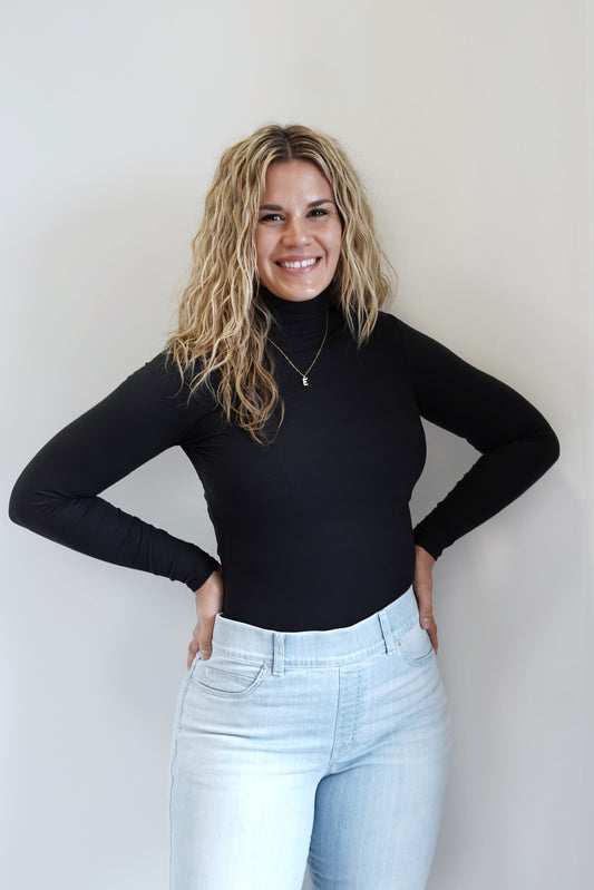 Spanx Suit Yourself Long Sleeve Turtleneck Bodysuit Turtleneck Long Sleeves Ribbed Fabric Black Color Fitted Thong Back 77% Polyester, 23% Elastane.