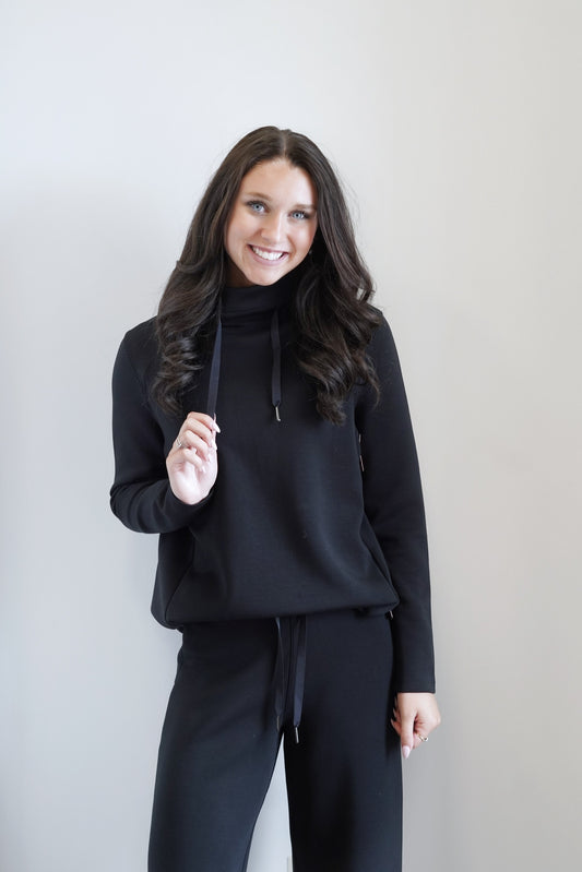 Spanx AirEssentials 'Got-Ya-Covered' Pullover High neck design keeps the cold air out Long Sleeves Colors: Black Drawstrings at Neckline Full Length Relaxed Fit 47% Modal, 46% Polyester, 7% Elastane