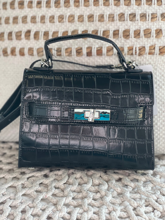 Small black purse with snakeskin detail and gold accents. Comes with a short and long strap.