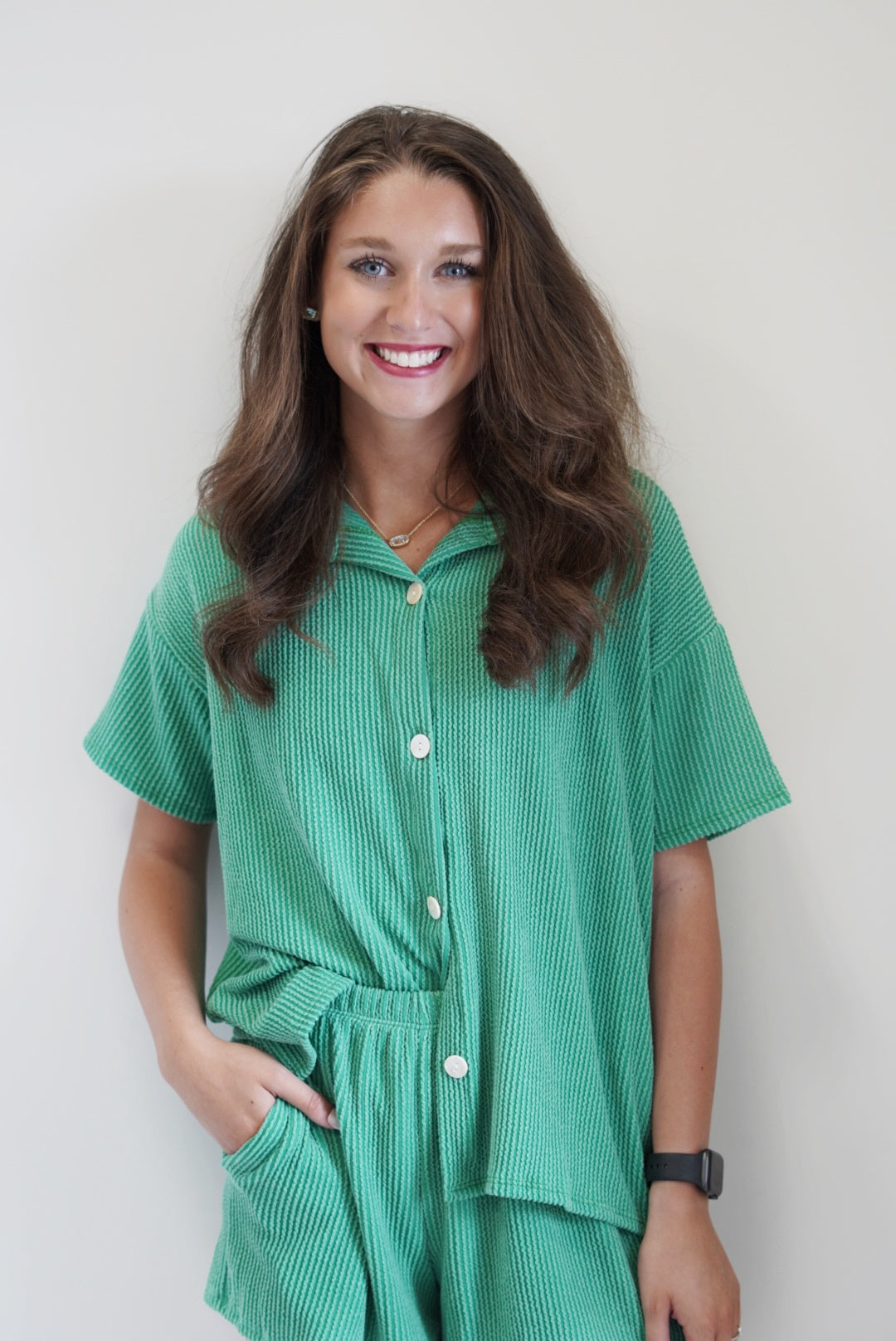 Tiffany Everyday Rib Top Collar Button Up Short Sleeved Rib Fabric 76% Polyester 21% Rayon 3% Spandex Hand Wash Cold, Do Not Bleach, Line or Hang Dry Model is wearing size: small