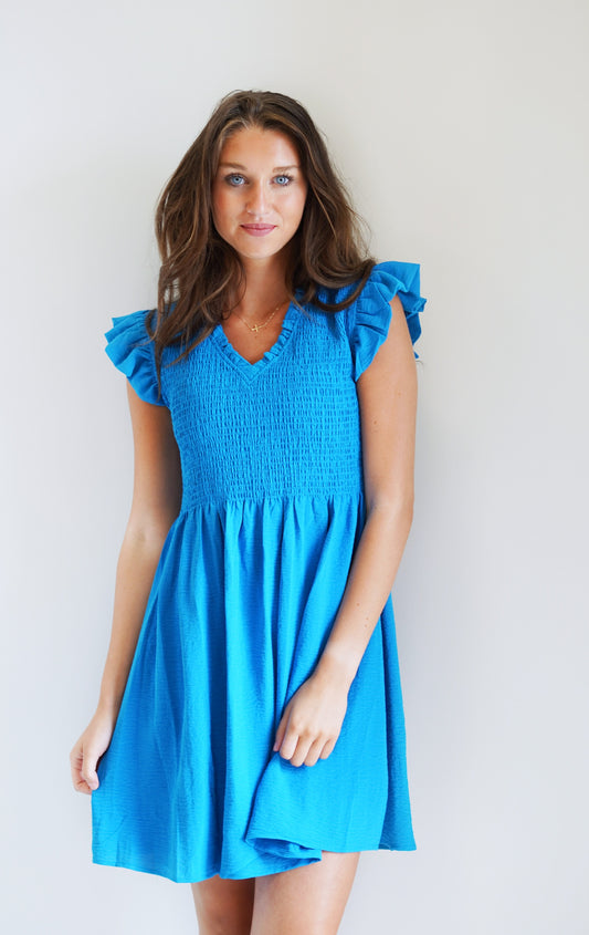 Tiffany Turquoise Ruffled Dress V Neck Line Ruffle Short Sleeve Textured material on top half Turquoise Knee Length Dress 100% Polyester Hand Wash Cold,Line Dry Model is wearing size: Small