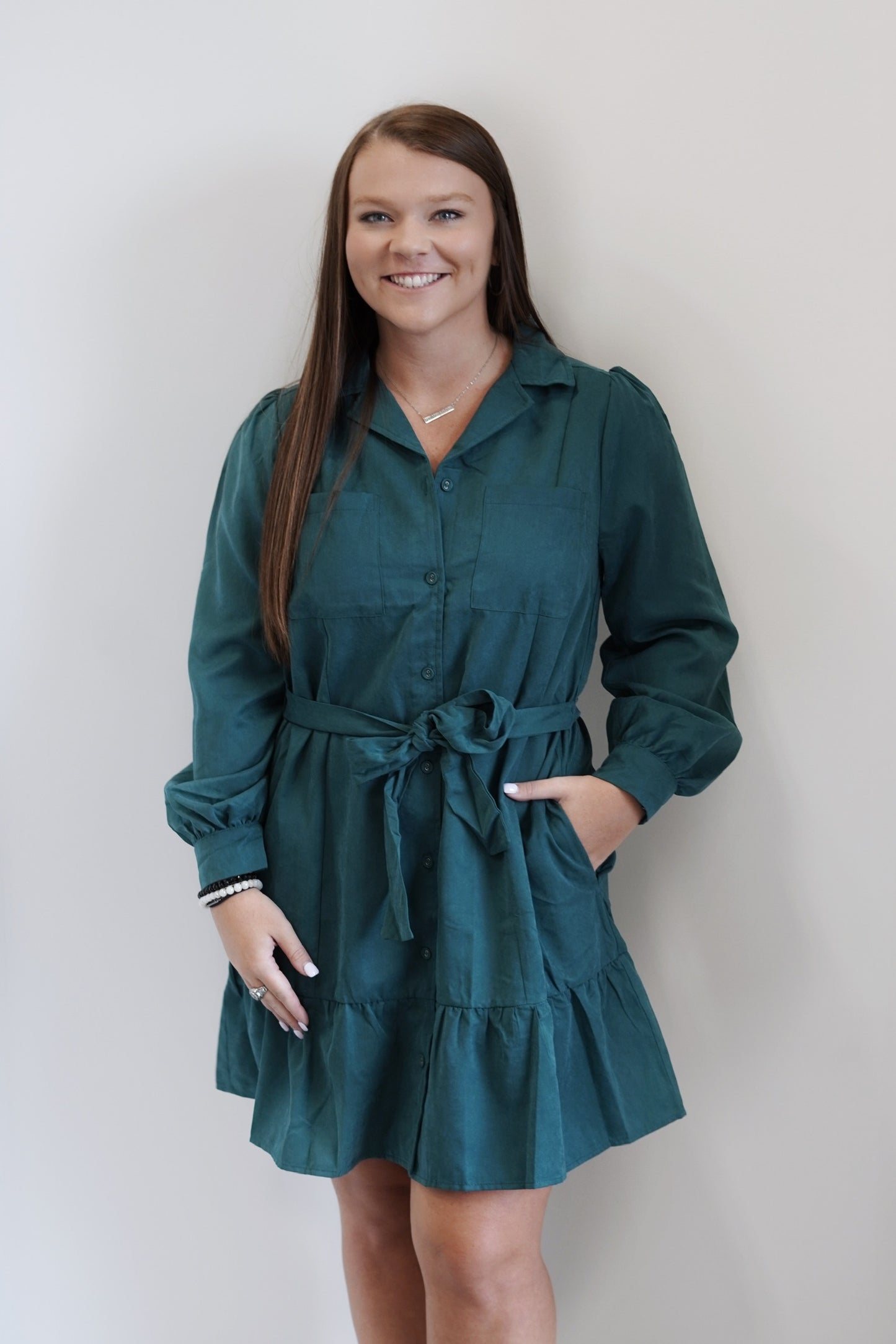 Cale Collared Waist Tie Dress Collared Neckline Long Cuffed Sleeves Front Chest Pockets Hunter Green Relaxed Fit 97% Polyester, 3% Nylon Care: Hand wash cold, Only use non chlorine bleach, Line dry, Low iron as needed