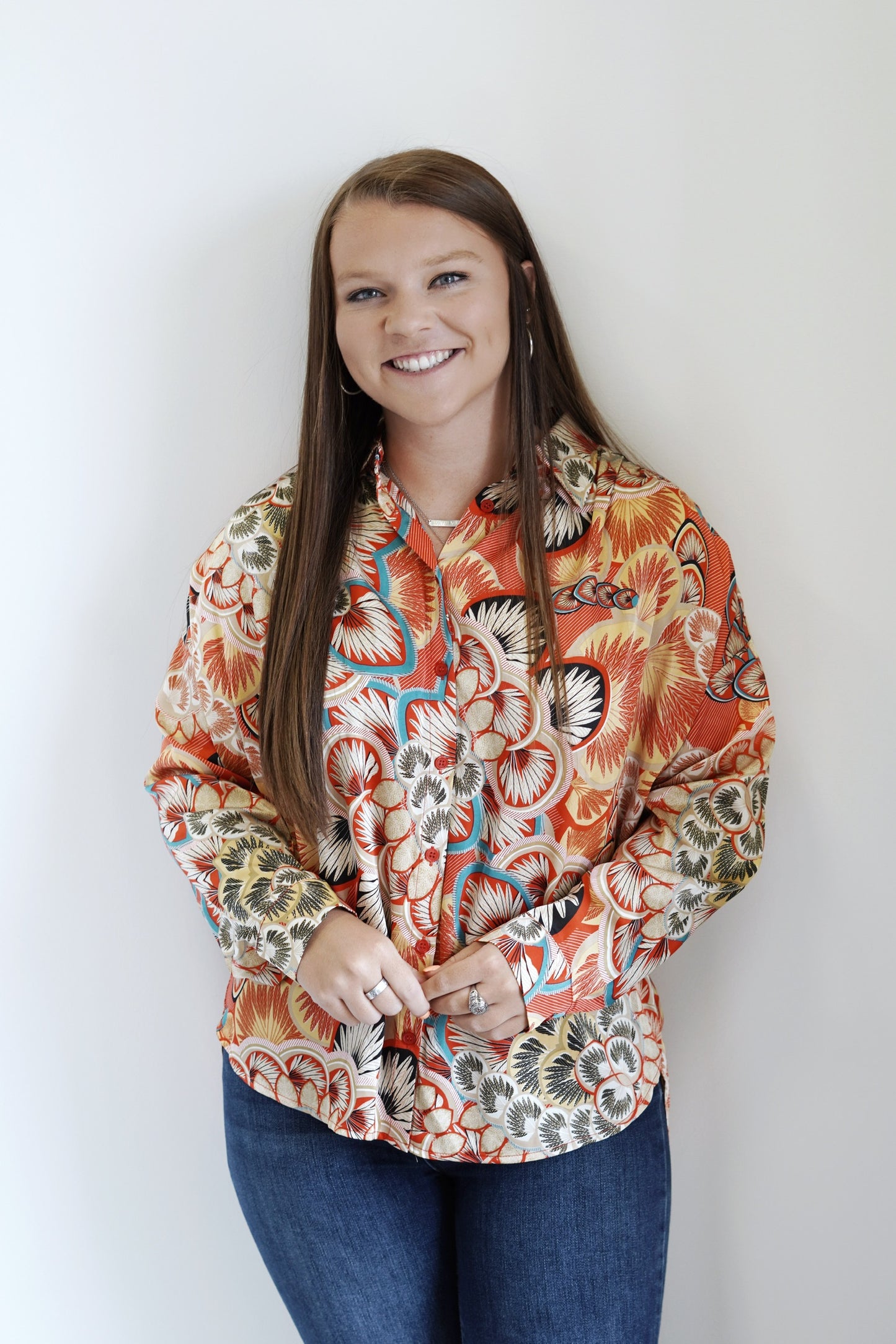 Val Vibrant Green Mix Button Up Blouse Collared Neckline Long Cuffed Sleeves w/ Buttons Button Up Feature Colors: Red/Orange Mix w/ other Vibrant Colors Satin Look Loose Fit 100% Polyester Care: Hand Wash Cold, Do Not Wring or Twist, Line Dry Model is Wearing a Size Small