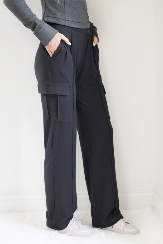 Lucy Straight Leg Cargo Pants Tapered Waist Band High Waisted Pockets, Butter Soft Fabric Black Full Length 84% Poly Microfiber, 16% Spandex Wash With Like Colors, Do Not Bleach, Do Not Iron Model is wearing size small