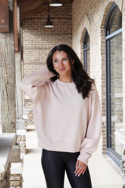 Spanx AirEssentials Crew Crew Neckline Long Sleeves w/ Cuff Color: Pale Pink Relaxed Fit At-the-hip length hits between mid and high hip 47% Modal, 46% Polyester, 7% Elastane.