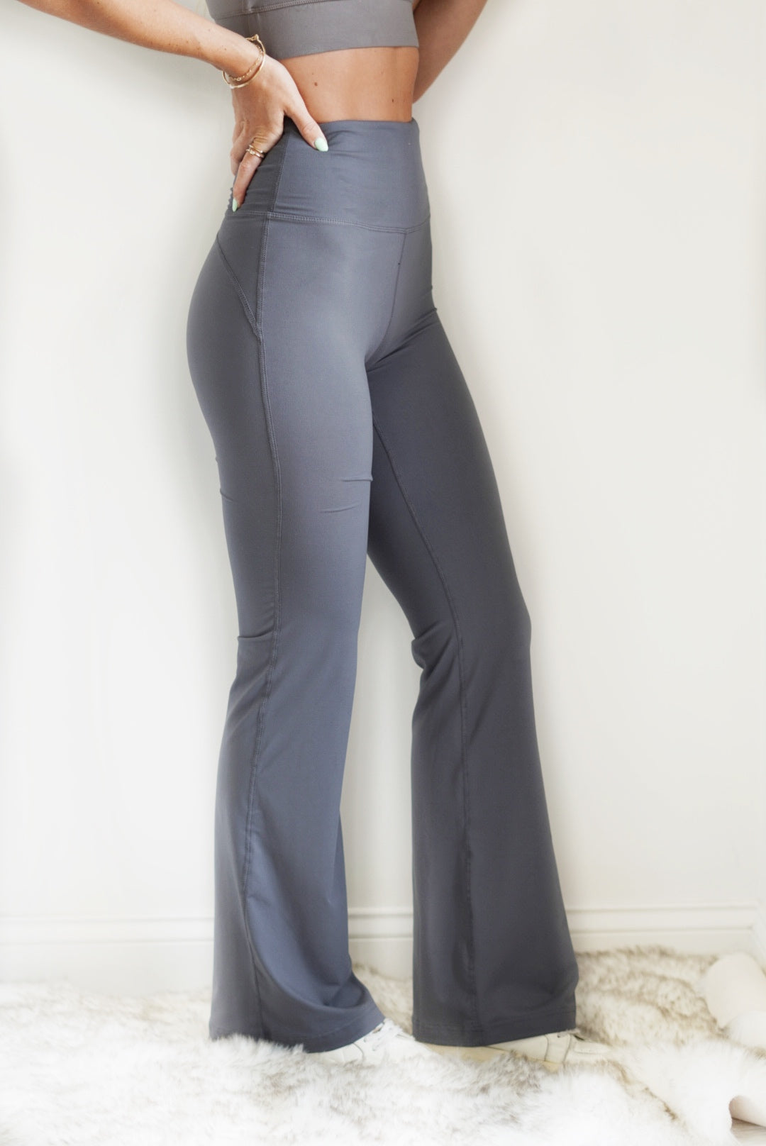 Your girl friends just texted you to invite you to go do yoga! You want to look cute, but still be comfy. Throw on the Harper High Waisted Bell Bottom Yoga Pants and you are all set! These pants have such a soft butter material, you will never want to take them off! Harper High Waisted Bell Bottom Yoga Pants High waisted Full Length Bell Bottom Fit Color, Titanium 84% Poly Microfiber, 16% Spandex Wash With Like Colors Model is wearing size small