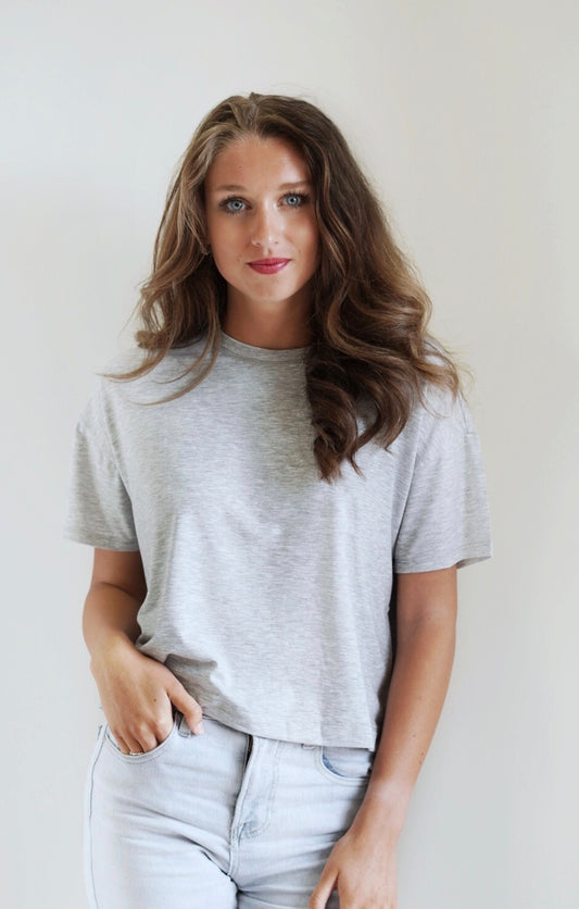 Reagan Relaxed Essential Top Crew Neckline Short Sleeve Stretchy/Soft Material Colors: Grey, Mocha Skimmer Length Relaxed Fit 60.4% Polyester, 32.6% Rayon, 7% Spandex Care: Hand Wash Cold, Do Not Bleach, Lay Flat To Dry, Cool Iron If Needed Model is Wearing a Size Small